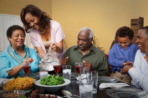 Multi-generation family eating dinner