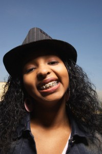 Teenage girl showing off her braces for the camera